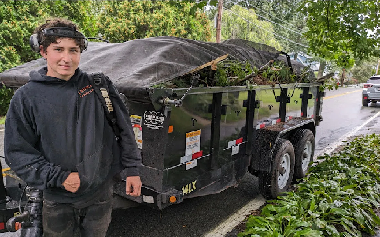 On site with the Tringale Landscaping truck and dump trailer after a job