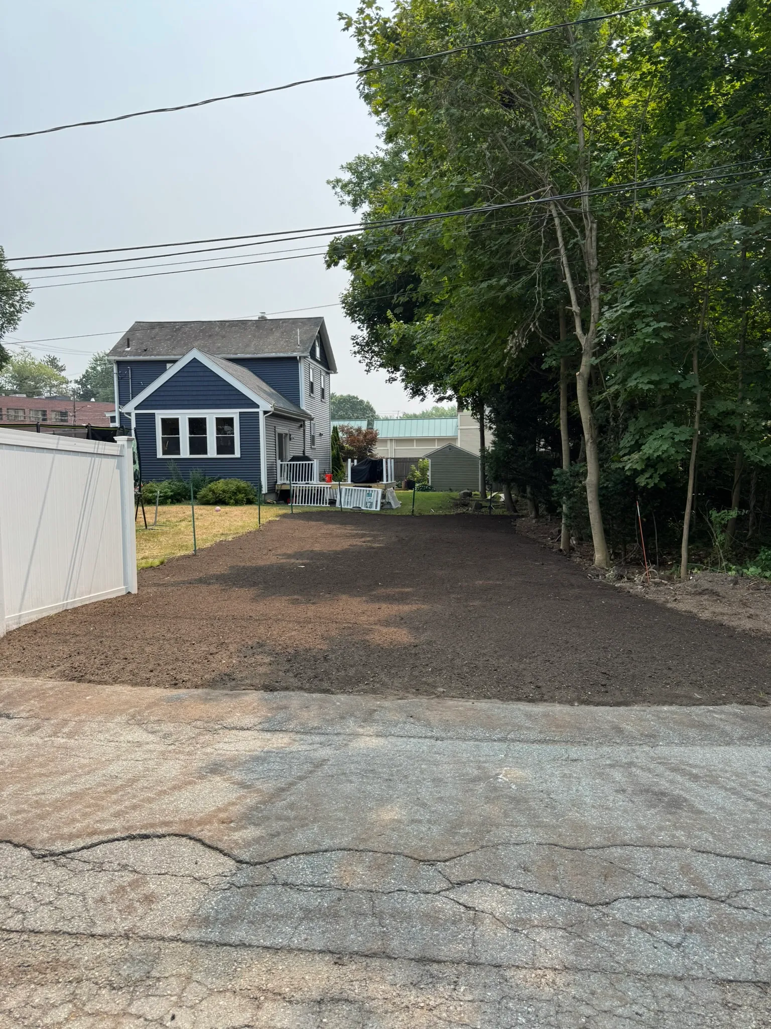 A flagstone landing and regraded drive during a hardscape project