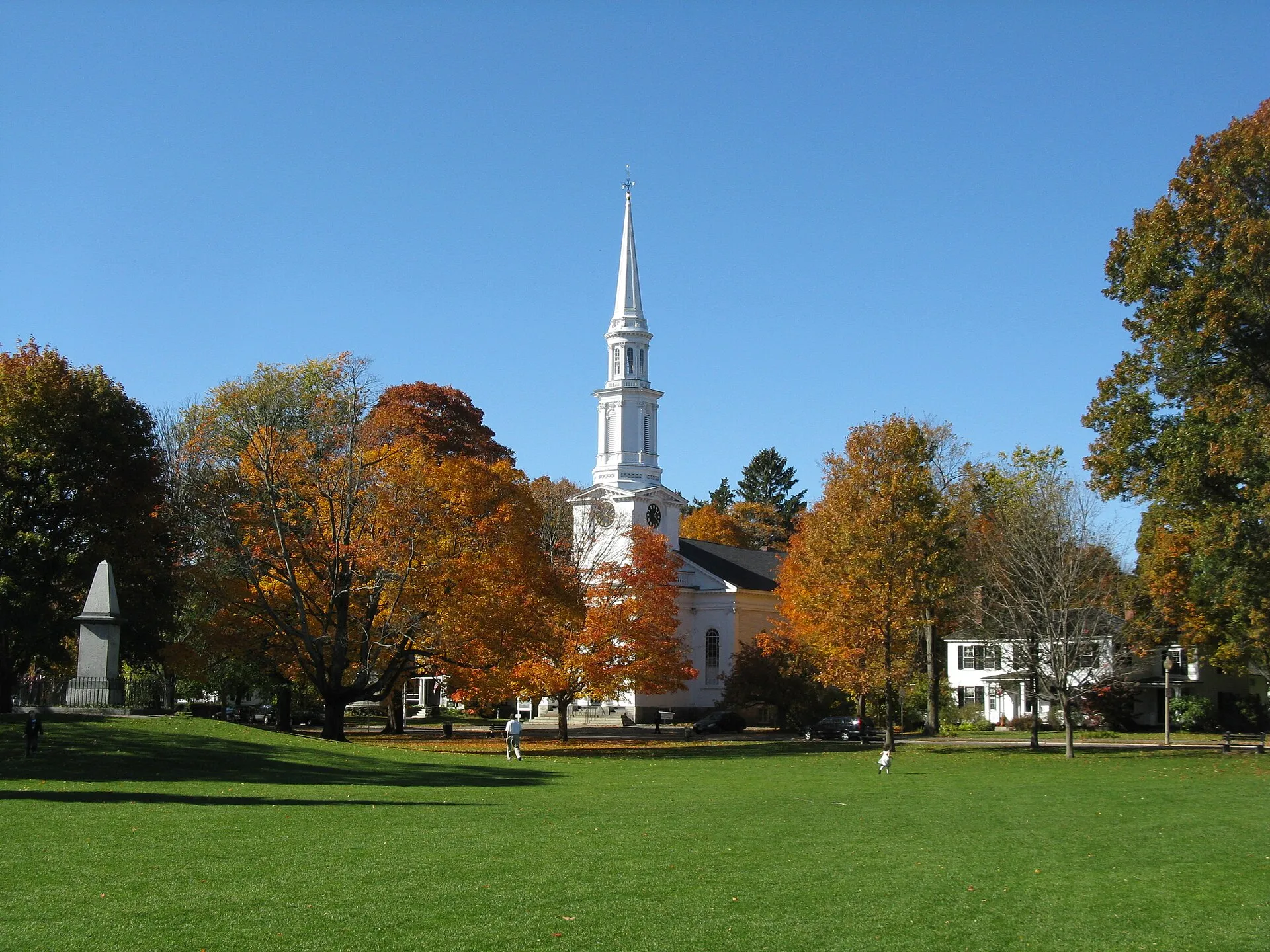 Lexington Battle Green with the historic white church steeple and manicured green common in autumn